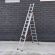 Драбина трисекційна 7 м алюмінієва ТЕХПРОМ 3 х 10 сходинок